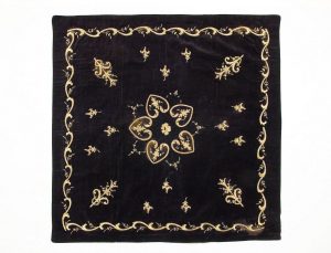 Dark blue velvet with laid and couched gold embroidery, domestic wrapper in secondary use.