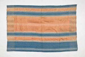Hand-woven silk with salmon pink and steel blue stripes, used to cover the dowry chest, belonged to S