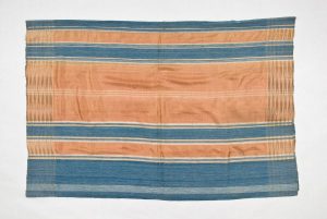 Hand-woven silk with salmon pink and steel blue stripes, used to cover the dowry chest, belonged to S