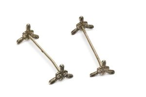 Cast silver utensil, bases with flower motif.