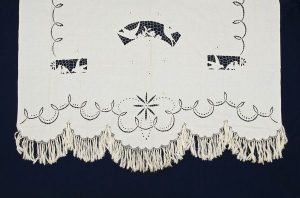 White cotton with openwork.