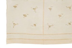 Hand-woven ivory silk with embroidered flower pattern in pale tones, belonged to Esther Modiano.
