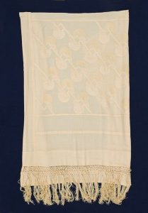 Crepe de chine with light beige embroidery in geometrical design.
