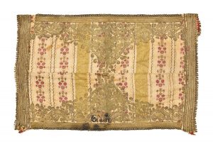 Cream cotton with gold stripes and floral pattern, gold embroidery with couched fine plaited strands, made from garment, edged with gold braid.