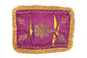 Purple silk with gold floral embroidery in couching technique, braided sandy brown silk edging.