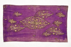 Purple silk with gold embroidered cut-outs in secondary use, used for the Brith Milah ceremony.