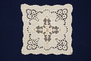Cream cotton cheese cloth with openwork and lace.