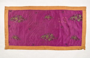 Violet silk with gold embroidery in couching technique, in secondary use, bordered with sandy brown silk.
