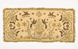 Wall hanging or cover, cream velvet with laid and couched gold embroidery, flower vases as central and corner motifs, birds, Turkish motifs of Tughra-like shapes, Star and Crescent .