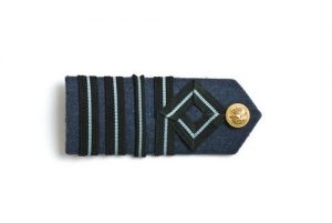 Blue wool epaulet with four light blue stripes and Air Force button, belonged to David Edgar Allalouf (1918-2003).