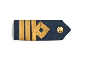 Blue wool epaulet with three gold stripes and Air Force button, belonged to David Edgar Allalouf (1918-2003).