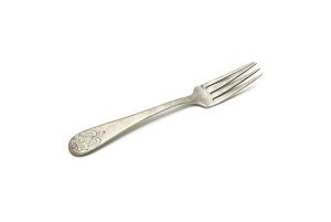 Silver cake fork engraved with scrolling tendril.