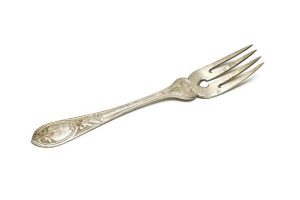 Silver cake fork with chased floral decoration.