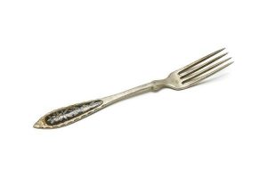 Silver cake fork with applique of floral decoration in niello.
