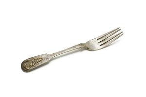 Silver cake fork with chased initials 