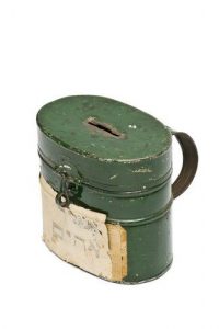 Painted tin money box with paper label.