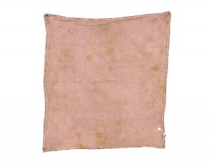 Pale pink cotton lining of gold brocade square.