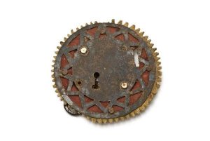 Circular iron lock with cut star motif.