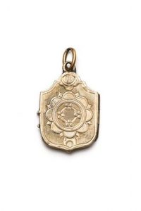 Gold locket with floral design