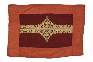 Reader's desk cover (?), maroon silk with gold embroidery, couched fine plaited strands, probably made from garment, bordered with terra cotta cotton.