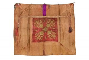Tik (Torah case) wrapper, faded red cotton, wine red silk centrepiece with laid and couched gold embroidery in secondary use, with dedicatory strip in tablet weaving technique, donated by Simhah, wife of Jacob Moses Benjamin to the New Congregation, Ioannina.