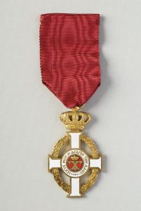 Gold Cross of the Order of King George I awarded to Elias Kofinas.