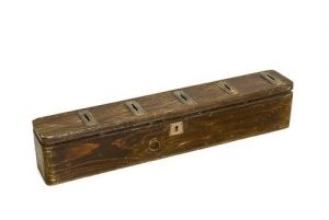 Wooden charity box with five metal slots.