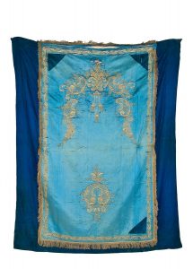 Torah Ark curtain, azure silk centrepiece with gold embroidered floral ornamentation, dark blue silk borders.