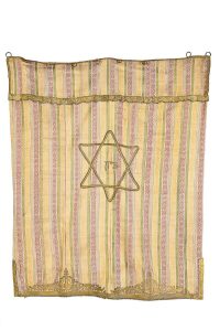 Torah Ark curtain, cotton (?) with woven multi-coloured stripes, made from gold embroidered Shalvari (baggy trousers).