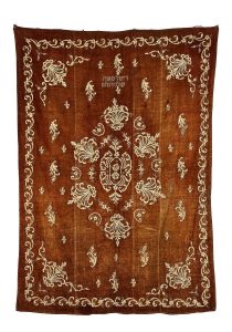 Torah Ark curtain, brown velvet with floral gold embroidery, made from a bedspread, dedicated by Rina Moses Solomon.