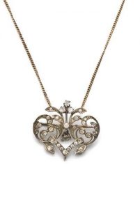 Silver pendant with floral ornament set with diamonts.