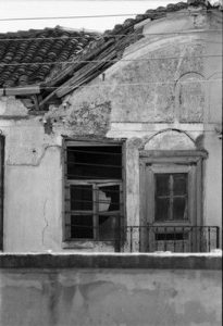 House -The new Synagogue of Xanthi-, with masks from scrolls over he windows.