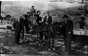 Photograph of a family on a horse-drawn cart.