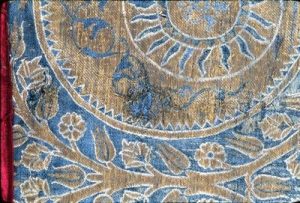 Close-up of textile before conservation.