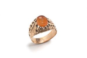 Woman's gold ring with gemstone, intaglio of ancient Greek god in profile.