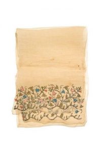 Cream cotton muslin with embroidered ends.