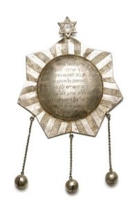 Silver dedicatory plaque in shape of seven-pointed star, dedicated by Leah, daughter of Isaac Joseph Atas.