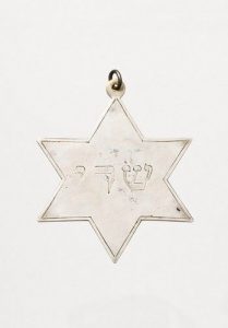 Silver dedicatory plaque in shape of Star of David.