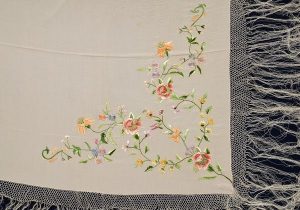 Ivory silk with coloured floral embroidery, belonged to Esther Modiano.