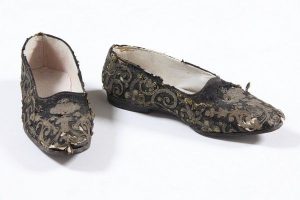 Pair of man's slippers for marriage, black fabric with braided gold cord embroidery, black leather sole, probably belonged to a member of the the local Jewish community.