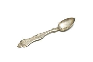 Engraved silver cake spoon.