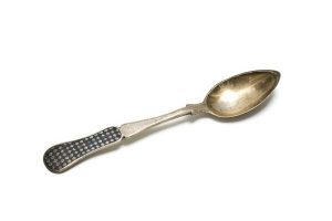 Silver cake spoon with checked pattern in niello.