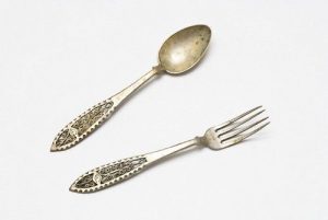 Spoon and fork with floral design on the handle