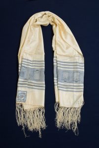 Prayer shawl, cream silk, grey-blue stripes with inscribed cartouches, light blue square corner reinforcements with Jewish motifs, belonged to David Asseo.