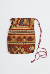 Drawstring bag for phylacteries, beige, blue and maroon printed cotton with horizontal stripes, geometric and floral design.