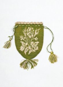 Drawstring bag, crocheted with light green and white silk threads, floral motif.