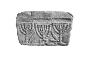 Copy of a capital fragment showing three Menorot, Lulav and Ethrog, belonged to one of the Synagogues of Corinth