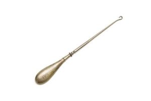 Silver tool for buttoning ladies' leather shoes and half-boots.