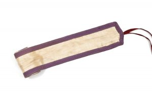 Narrow cream satin band with lining, trimmed with violet cotton ribbon.