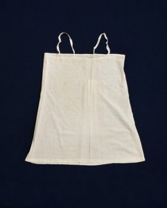 White cotton undershirt with lace, belonged to Esther Modiano.